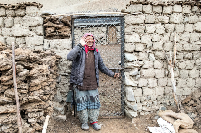Cattle herder in front of newly built and snow leopard proof barn. - photo: HAHF